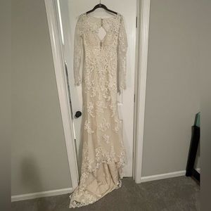 Maggie Sottero long sleeve, lace wedding dress. Ivory. Size 8. Used